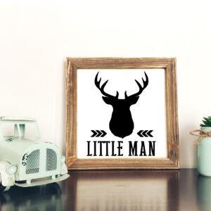 A small toy truck, a 12x12Little Man framed sign with a deer head silhouette, and two potted succulents are arranged on a white surface against a plain wall. - Spruced Studio Upscale Workshop