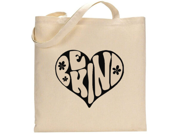 The "Be Kind (heart)" beige canvas tote bag features a heart-shaped design with the words "Be Kind" and two small black flowers. - Spruced Studio Upscale Workshop