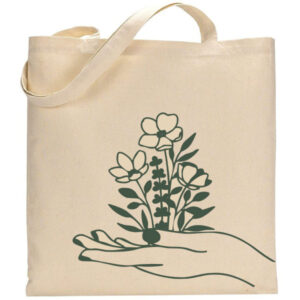 Hand w/ Wildflowers beige tote bag features a graphic of an open hand holding three stylized wildflowers and dark green foliage. - Spruced Studio Upscale Workshop