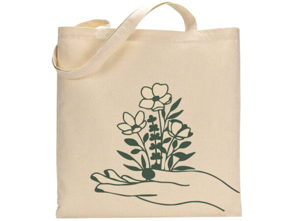 Hand w/ Wildflowers beige tote bag features a graphic of an open hand holding three stylized wildflowers and dark green foliage. - Spruced Studio Upscale Workshop