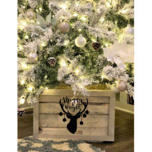 The Tree Box - Deer with Ornaments features a frosted Christmas tree with white lights and ornaments in a wooden box base, adorned with a black reindeer head and the phrase "Merry & Bright. - Spruced Studio Upscale Workshop