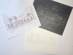 Three sheets of paper show different stages of a house drawing: a finished line sketch, a black graphite transfer sheet, and a faint pencil outline on textured paper. - Spruced Studio Upscale Workshop